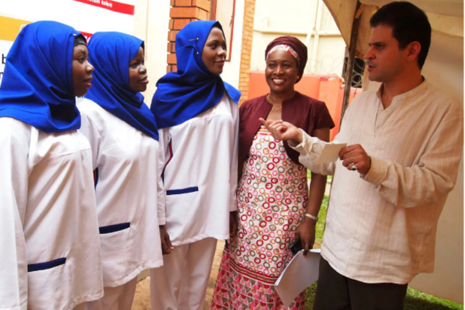 arabian recruiter speaking to ugandan wokers